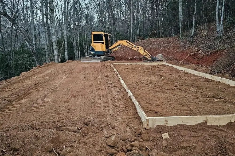 Excavator preparing a construction site.