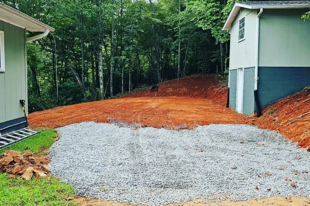 Gravel driveway under construction in woods